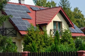 a nice house with solar panels installed on the roof